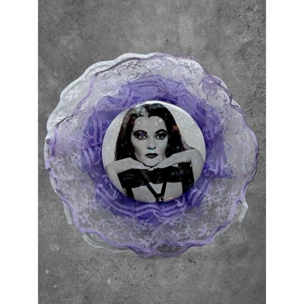 2.25” Lily Munster holographic star button with a layered purple and white lace